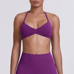 Close-up of purple seamless high-stretch halter sports bra and high-waisted leggings set