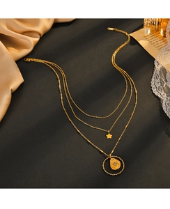 Detailed view of 14K gold-plated triple-layer necklace with star and circle pendants