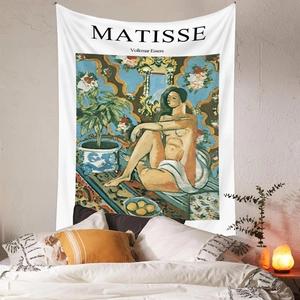 Detailed view of a Matisse art tapestry on a bedroom wall with warm cozy lighting
