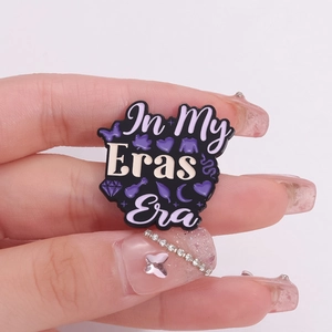 In My Eras Era enamel pin featuring butterfly heart and guitar motifs on black finish