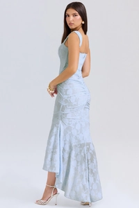 Detailed view of light blue bodycon maxi dress with floral jacquard texture and open back