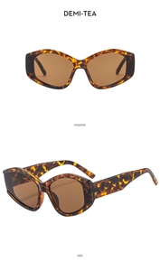 Detail view of demi-tea irregular sunglasses with thick frames and cat-eye geometry