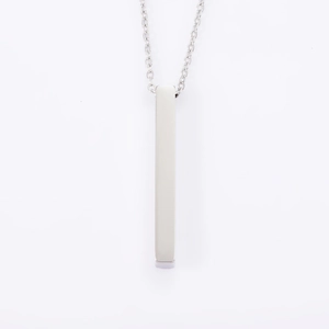 Detailed view of a minimalist vertical bar pendant necklace in polished silver steel