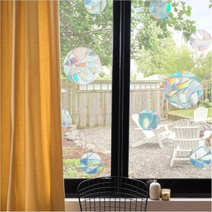 Rainbow prism static window clings with circular geometric patterns on glass