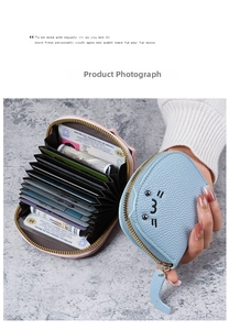 Detail of cute cat shaped wallet featuring cat tail zipper and lychee leather texture