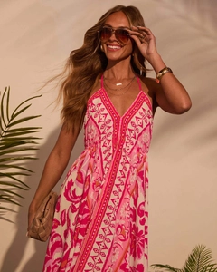 Detail of bohemian halter neck maxi dress with pink floral patterns for summer vacation