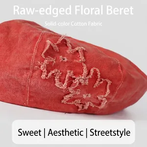 Retro washed cotton beret with raw-edge flower patch in brick red for a vintage look