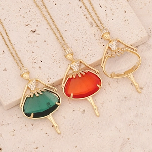 Elegant gold ballerina dancer pendants with red and green gemstones on gold necklaces