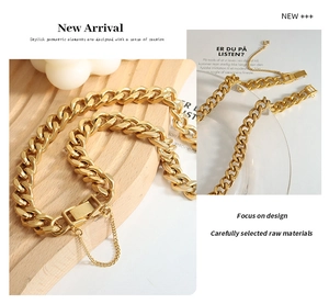 Close-up of gold-plated thick cuban chain with secure box clasp and safety chain detail