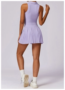 Back view of a lavender tennis set featuring a sleeveless polo top and pleated skirt