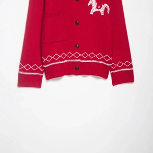 Red knit cardigan featuring white horse embroidery and argyle pattern on hem