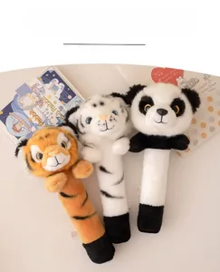 Detail of plush animal head massage sticks featuring tiger and panda soft toys