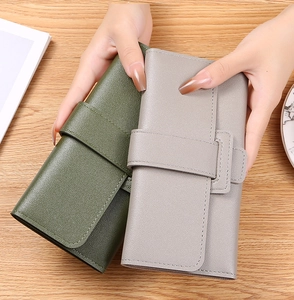 Handheld dark green and light gray leather long wallets with decorative buckle detail