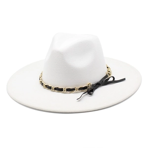 Detail of white wide brim fedora hat featuring gold chain and black leather ribbon band