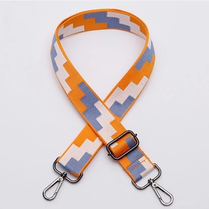 Detail of No. 321 adjustable wide strap with yellow geometric patterns and gunmetal hardware
