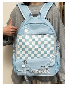 Light blue preppy backpack with clear PVC window and acrylic chain shown on model