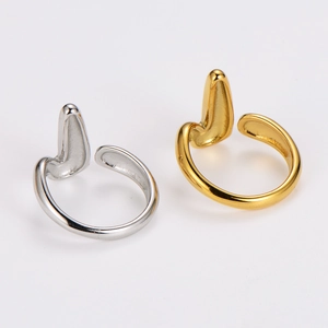 Minimalist V-shaped open rings in gold and silver finish on a clean white background