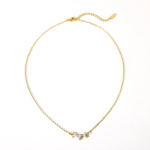 Elegant gold stainless steel necklace featuring three sparkling heart shaped crystals