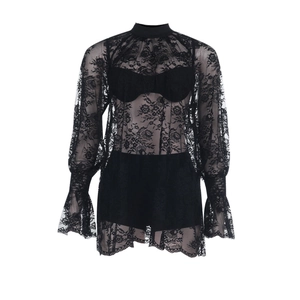 Detailed view of black lace long sleeve top featuring sheer floral patterns and flared cuffs