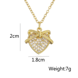 Detail view of gold heart pendant with cubic zirconia and dimensions 2cm x 1.8cm
