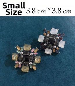 Detailed macro view of a vintage geometric brooch with colorful rhinestones, 3.8x3.8 cm