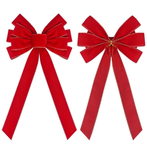 Large red velvet Christmas bows with gold trim shown from front and back on white background