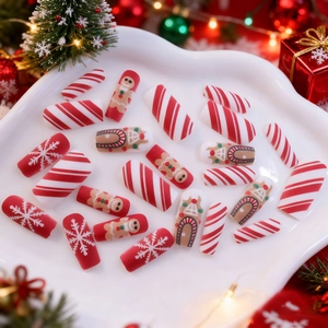 Weihnachts-Nägel zum Aufkleben mit roten und weißen Schneeflocken-Mustern