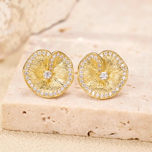 Golden S925 silver lotus leaf earrings with brushed texture and zircon accents