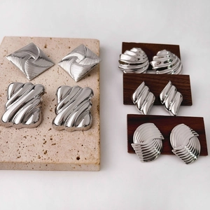 Chic silver geometric earrings collection with textured metal and sleek polished finishes