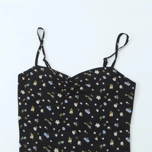 Floral print waist-defining maxi camisole dress with adjustable straps on white background