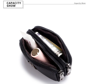 Detail view of double zipper coin purse in black litchi leather showing inner capacity