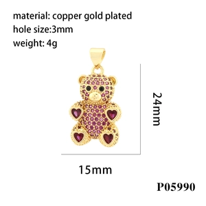 Detail view of 24mm gold bear pendant with pink zircon and exact dimensions display