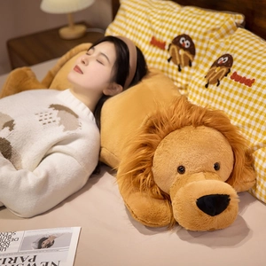 Large soft lion plush pillow with fluffy mane in cozy bedroom setting for kids and adults