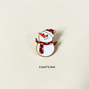 Detailed size view of a 2.2cm x 3.3cm snowman enamel brooch with red and white colors