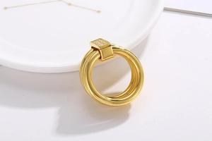 Macro view of 18k gold plated three-ring band with CNC micro-pave diamond setting