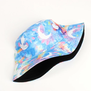 Detail of tie-dye bucket hat with moon and butterfly print showing black inner lining