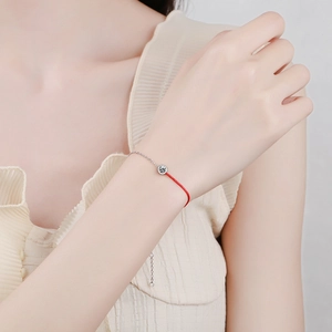 Elegant S925 silver red string bracelet with a 0.3ct moissanite diamond on wrist