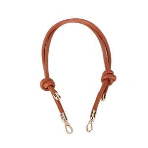 Adjustable brown leather shoulder strap with knot detail and gold spring buckles