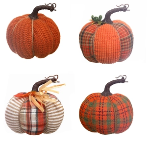 Set of four autumn fabric pumpkins in various knit and plaid patterns for table decor