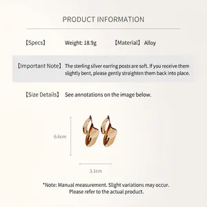 Detailed size view of gold geometric twisted leaf earrings with 6.6cm length measurements