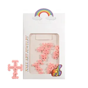 Rosa 3D-bemaltes Kreuz-Nagelkunst-Set in einer weißen Schaufenster-Verpackung
