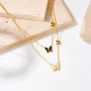 Double-layered gold-plated stainless steel necklace with black and white butterfly pendants