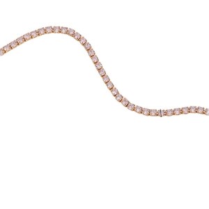 14K gold plated tennis chain necklace with sparkling cubic zirconia on white background