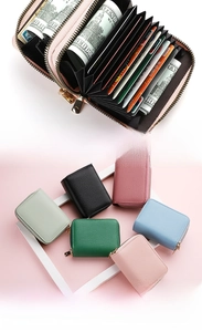 Detail of the multi-layer accordion card slots with golden zipper and lychee texture