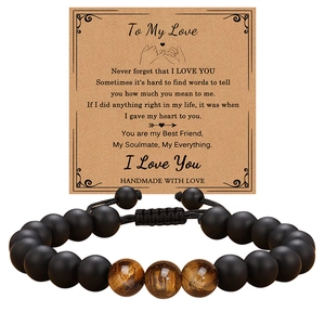 Tiger eye and matte stone beaded bracelet presented on a sentimental greeting gift card