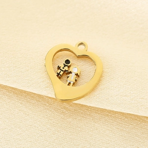 Macro view of gold heart pendant with boy and girl figures in stainless steel
