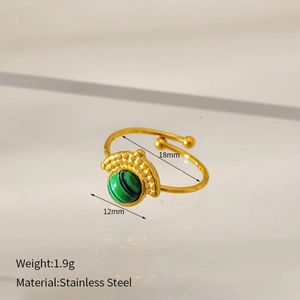 Macro detail of gold stainless steel ring featuring dimensions 18mm and green stone