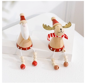 Detail of wooden Santa and Reindeer ornaments with red hats and dangling wood bead legs