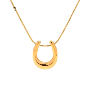 Polished 18K gold-plated stainless steel horseshoe pendant on a delicate snake chain