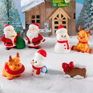 Miniature Christmas resin figurines set featuring Santa, snowmen and reindeer for decor